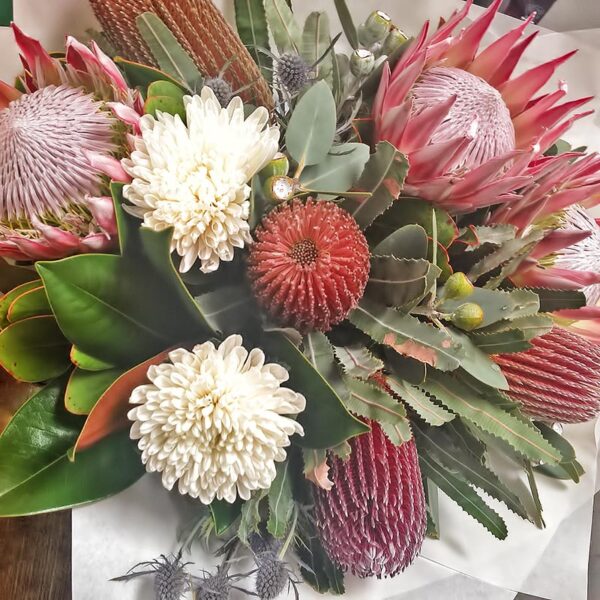 Lovely mix of Banksia Natives with White Disbud Chrysanthemums, Seaholly & Magnolia Foliage