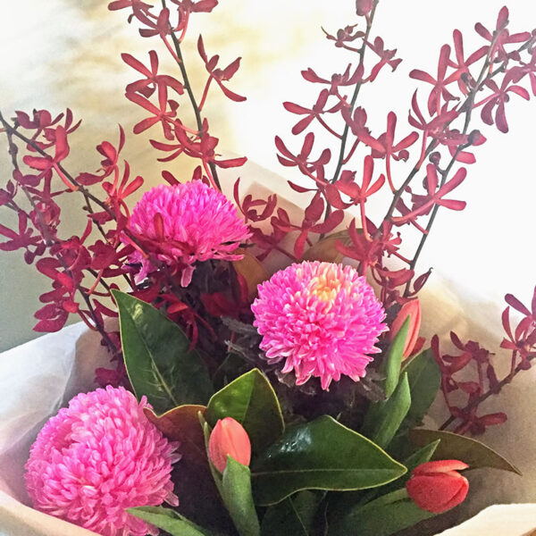 Splendour Red Spider Orchids with Pink Disbud Chrysanthemums and Tulips with Magnolia Foliage