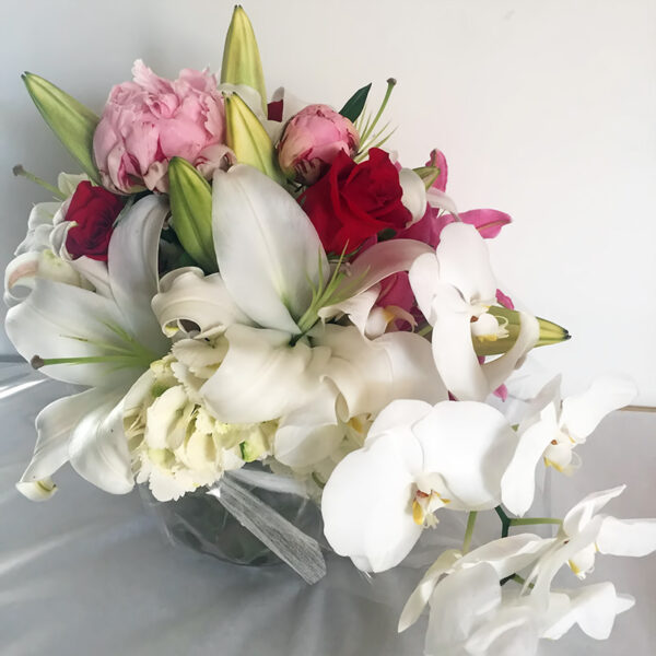 Deluxe Fishbowl Arrangement with White and Pink Oriental Lillies, Peonies, Red Roses, Spray of Phalaeonopsis Orchid